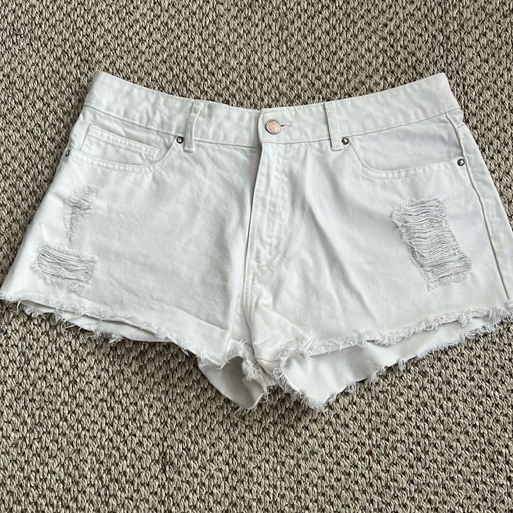 White, distressed jean shorts